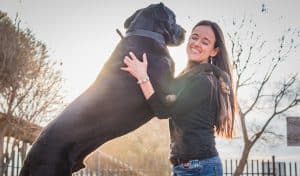 woman hugging dog