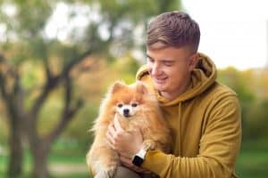 young man and dog