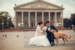 happy couple brown dog