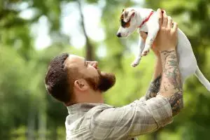 man holding dog