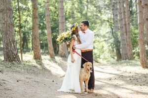 groom and bride with labrador