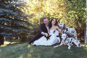 dalmation and couple in forest