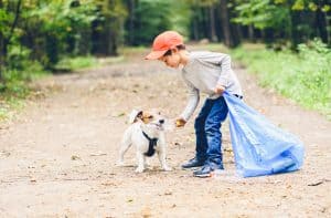 boy and dog recycling