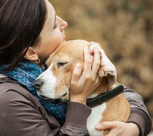 woman and blonde dog