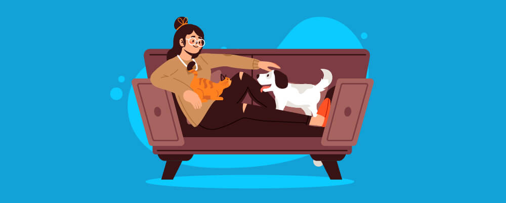 Pet owner with her dog and cat on the couch
