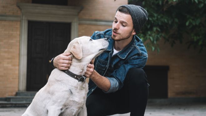 guy talking to dog